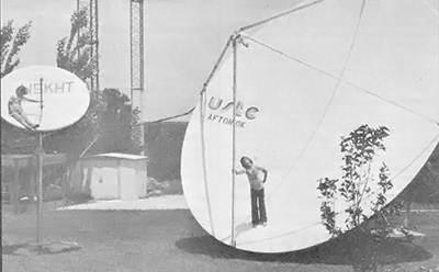 Cooper's two children in 5- and 20-foot-diameter parabolic television antennas.